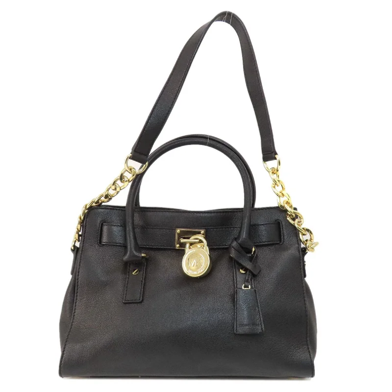 Handle bags with expandable sides for flexibility -Michael Kors  Leather Tote Bag (Pre-Owned)