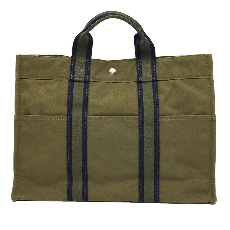 Handle bags with hidden pockets for security -Hermes  Canvas Tote Bag (Pre-Owned)