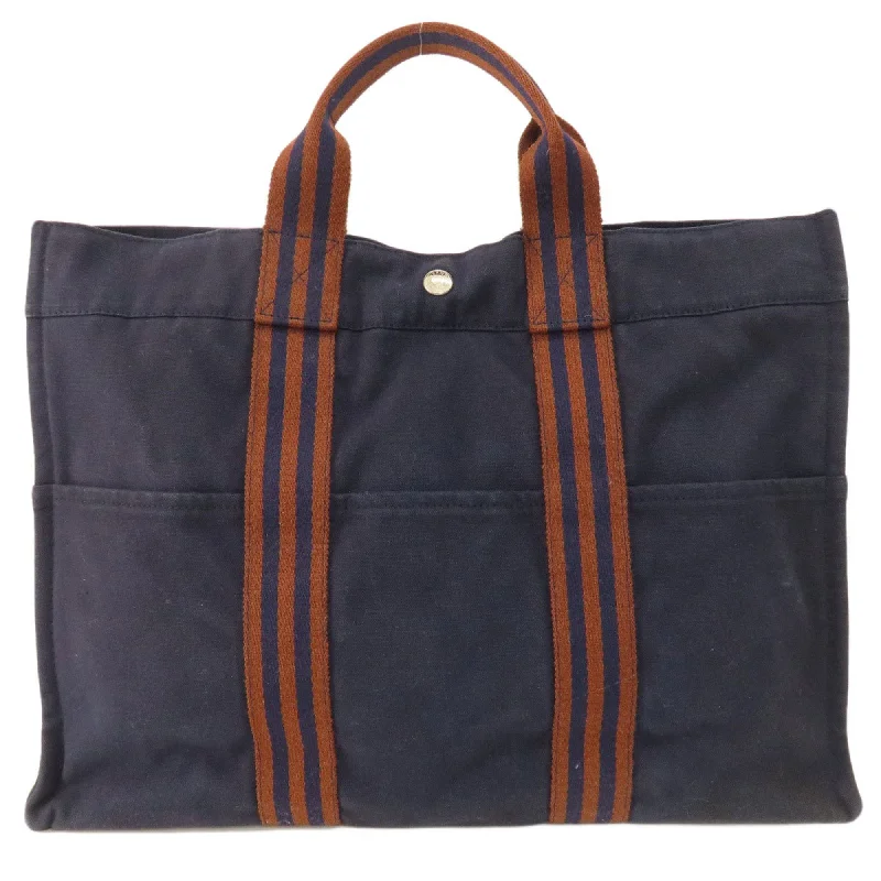 Handle bags with detachable pouches for versatility -Hermes  Canvas Tote Bag (Pre-Owned)