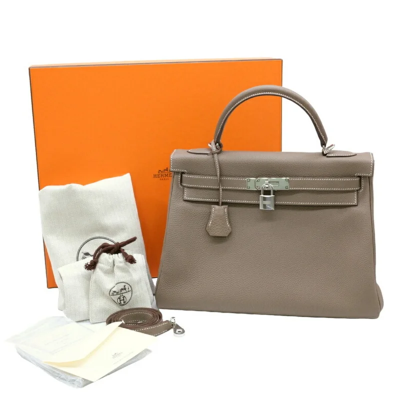 Handle bags with colorful handles for flair -Hermes Etoupe  Taurillon Clemence Leather Handbag Tote Bag (Pre-Owned)