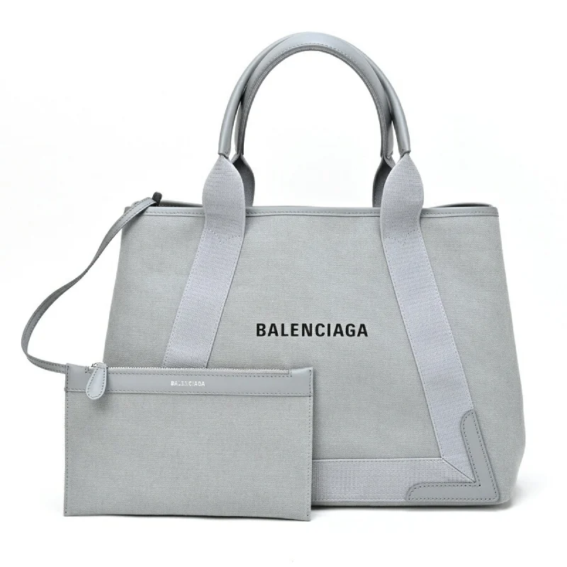 Handle bags with playful pom-poms for charm -Balenciaga  Canvas Tote Bag (Pre-Owned)