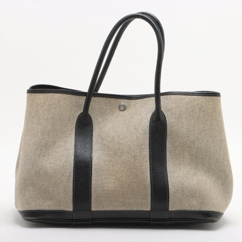 Handle bags with vintage vibes for nostalgia -Hermes   Canvas Leather Tote Bag (Pre-Owned)