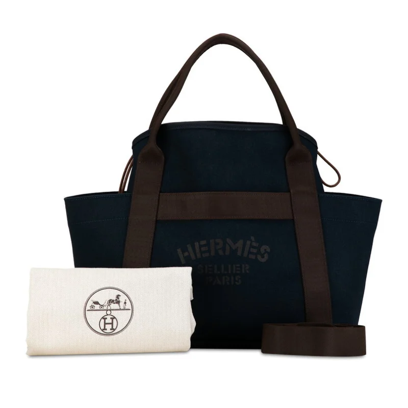 Handle bags with compact designs for portability -Hermes  Navy Canvas Shoulder Bag Tote Bag (Pre-Owned)