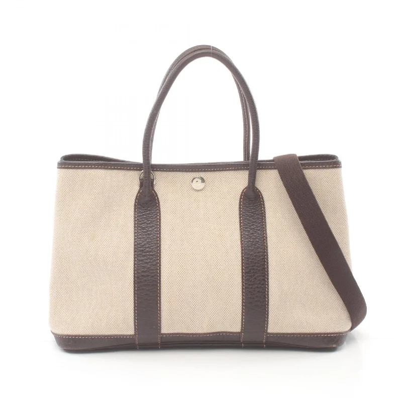 Handle bags with bold stripes for trendiness -Hermes  ivory Toile H Tote Bag (Pre-Owned)