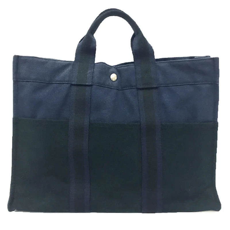 Handle bags with hidden pockets for security -Hermes  Navy Canvas Tote Bag (Pre-Owned)